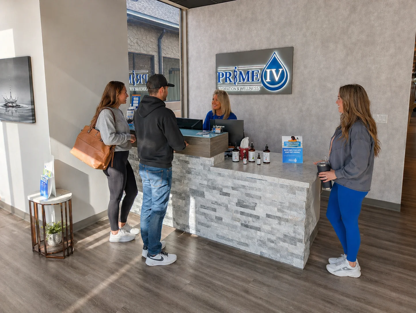 Guests checking in at the Prime IV Kansas City front desk at Burlington Creek